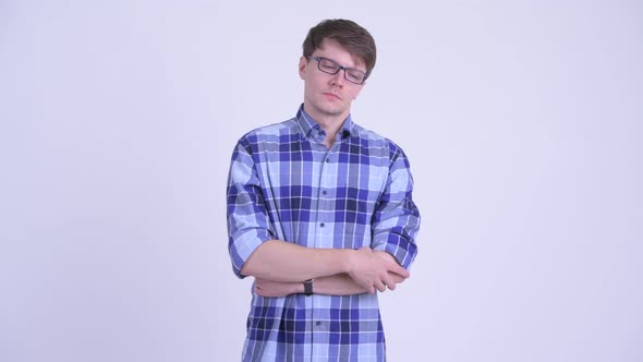 Stressed Young Hipster Man Looking Bored While Waiting alt