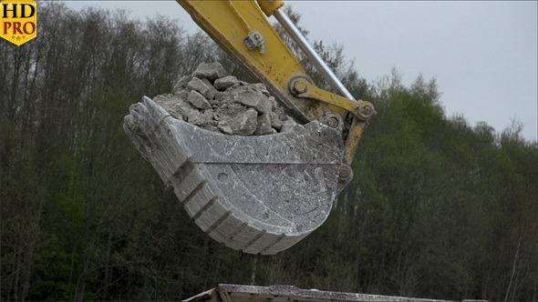A Backhoe s Head with Stones
