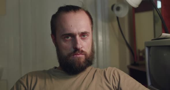 Portrait of Charismatic Man Looking Surprised at the Camera and Nodding His Head alt