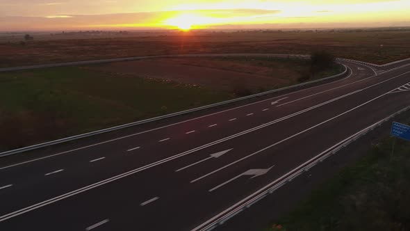 Flight Over the Highway in the Evening with Sunset