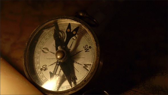 A Compass and the Candle on the Map