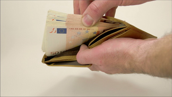 A Man Counting Off his Money in his Wallet