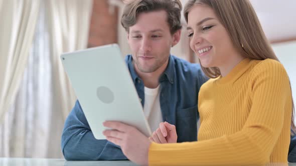 Happy Office Colleagues Doing Video Chat on Tablet alt