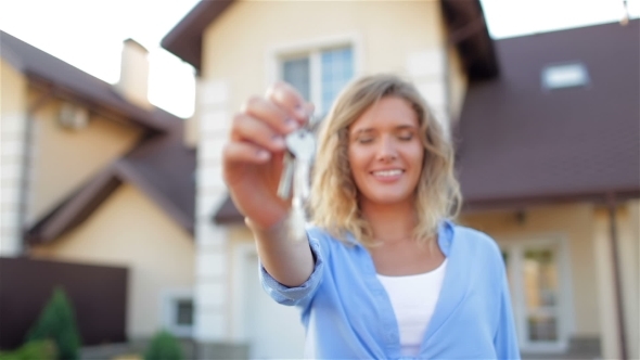 Pretty Girl Showing Keys. alt