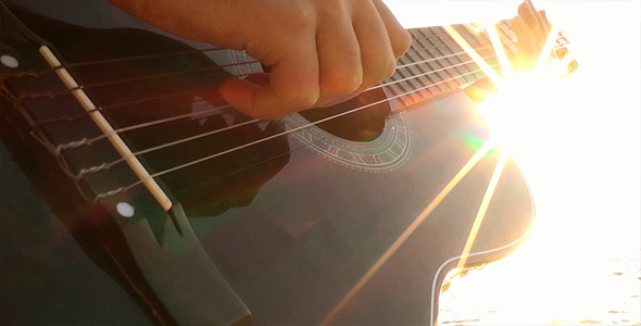 Playing Guitar at Sunset