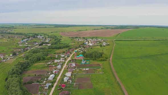 Green Open Field and Small Villages with Cultivation Fields alt