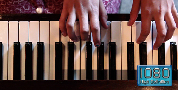 Female Hands Playing Piano 