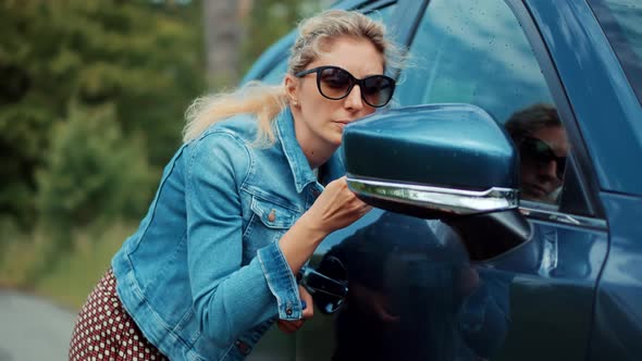 Lady Paints Her Lips With Lipstick.Outdoor Makeup Before Date With Boyfriend.Makeup Lipstick Dating alt