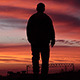 Lonely Man Goes Along The Road Against Sunset Lonely Man Goes Along The Road Against Sunset - VideoHive Item for Sale
