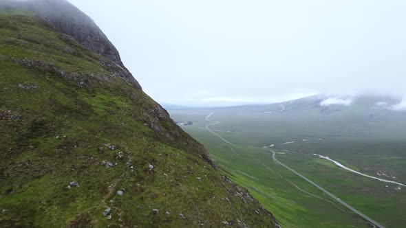 A large mountain in Scotland revealed in cold cloudy conditions alt