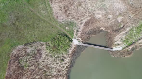 Aerial Landing On The Bridge At The Lake