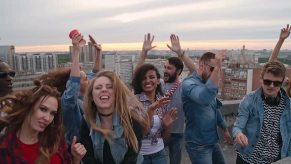 Happy Diverse Clubbers on Rooftop alt