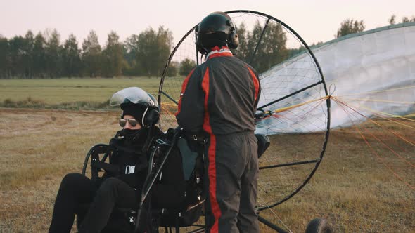Pilot Checking Airflow Through Parachute alt