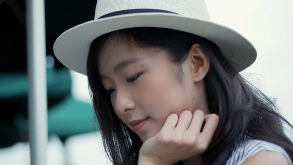 Beautiful Asian woman portrait of attractive smiling at a cafe shop.