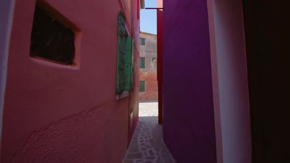 Narrow Paved Walkway Between Colored Houses in Burano alt