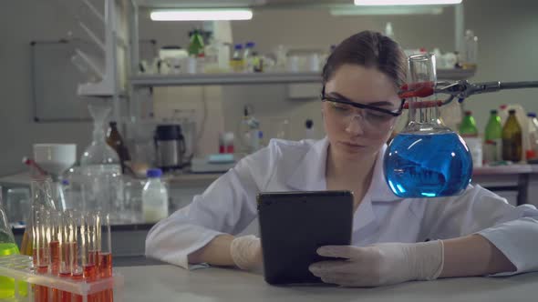 Lab Technician Performs Medical Tests Alone in Office alt