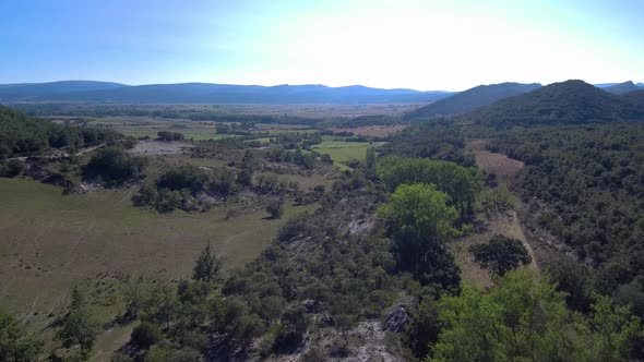 This is a beautiful aerial recording of nature green forest, rocky.In spain. alt