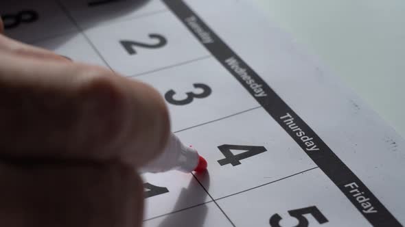 Macro Shot Date of Month on Calendar Circled By Red Marker alt