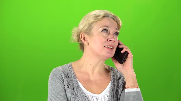 Housewife Speaks on the Phone. Green Screen alt