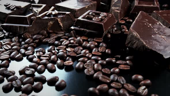 Dark Organic Chocolate and Coffee Beans on Concrete Background alt