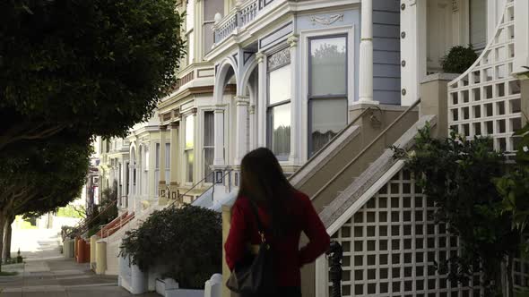 Woman walking in a city street alt