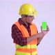 Young Happy Hispanic Man Construction Worker Showing Phone and Giving Thumbs Up - VideoHive Item for Sale