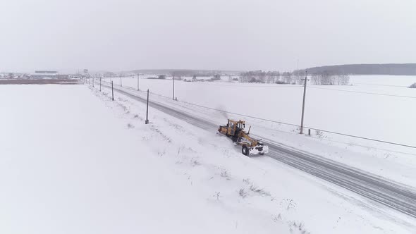 Aerial view of Snowblower Grader Clears Snow Covered Country Road 03 alt