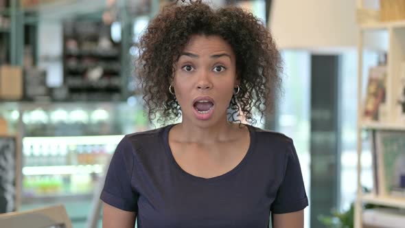 Portrait of Disappointed Young African Woman Reacting To Loss alt