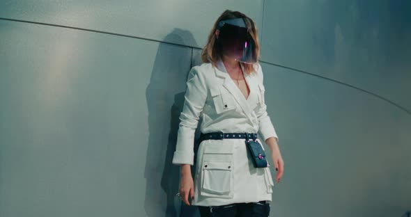 Stylish Woman at Night City Streets in Modern Protective Face Shield Covid 19 alt