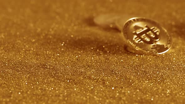 Bitcoin is Spinning on a Table with Golden Sand