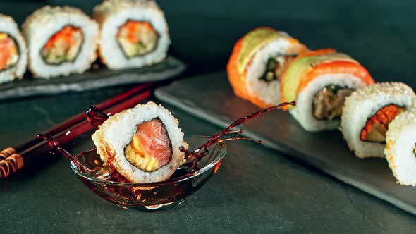 Super Slow Motion Shot of Fresh Sushi Falling Into Soy Sauce at 1000Fps. alt