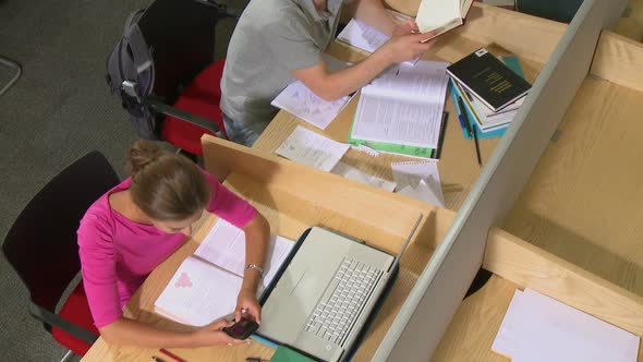 Female student on mobile phone texting alt