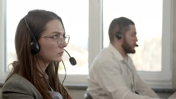 Young Woman Having Business Call in Office