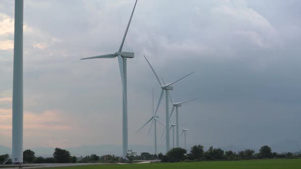 Contemporary Windmills Row Generate Energy with Blades alt