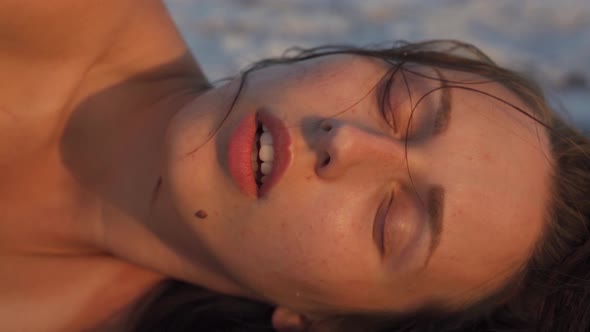 Attractive Soulful Nude Emotive Caucasian Female at a Salt Lake in Slow Motion alt