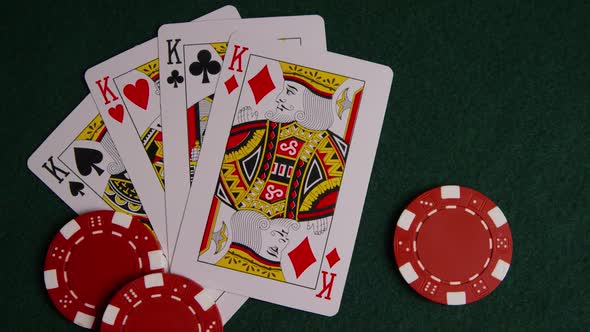 Rotating shot of poker cards and poker chips on a green felt surface - POKER 008 alt