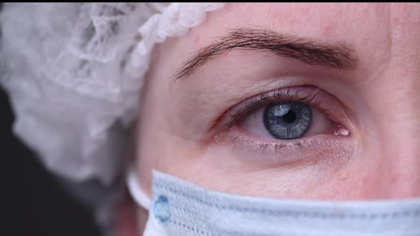 Viral Epidemic Covid-19. Large Girl's Face and Eyes. Medical Mask and Other Ways To Protect Against alt