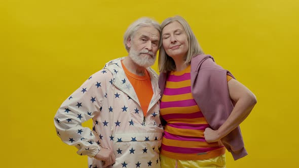 Elderly Man And Woman Come On Yellow Background alt