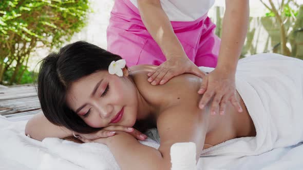 Spa Luxury Woman relaxing getting massage at hotel resort