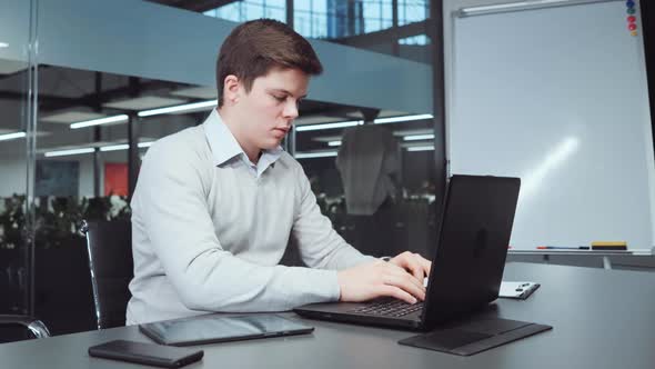 Financial Analyst Preparing Report Before Deadline alt