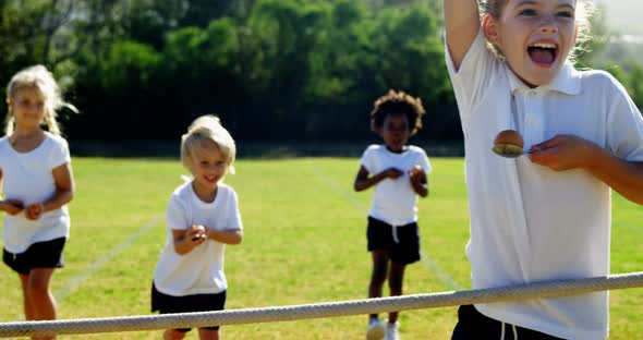 Children playing lemon and spoon race, Stock Footage | VideoHive