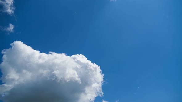 Clouds Move Smoothly in the Blue Sky. Timelapse alt