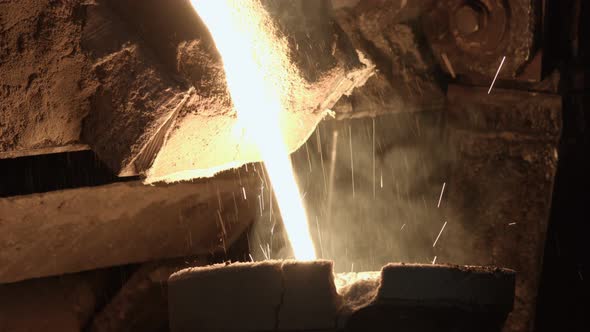 The Molten Metal Pours Into The Mold