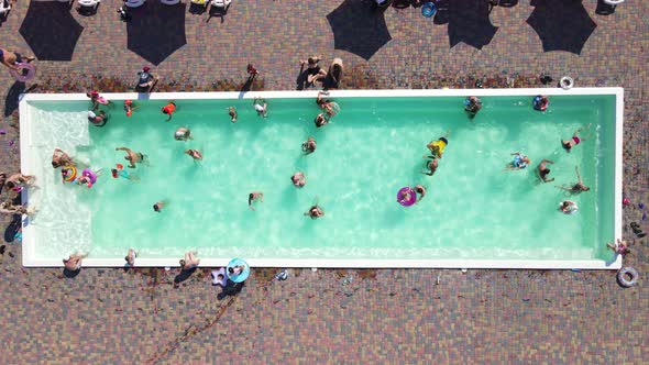 People Having Fun In A Warm Pool On Vacation