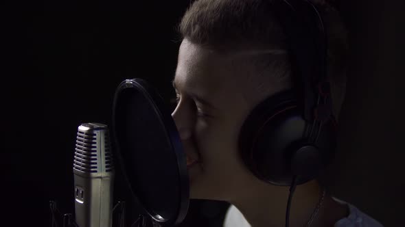 Boy Singing in Studio alt