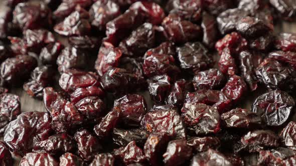 Dehydrated red cranberries on table shallow DOF 4K 2160p 30fps UltraHD tilting footage - Red dried b alt