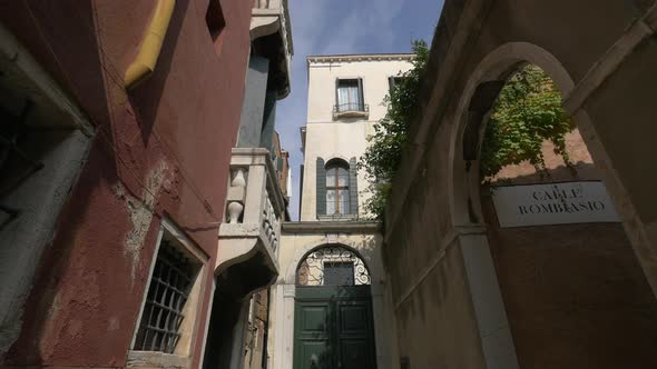 Narrow street with buildings and massive doors