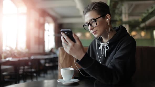 Girl Drinking Coffee and Listening Music alt