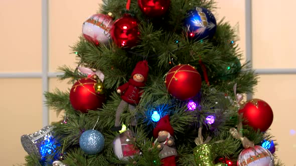 Christmas Decorations on Christmas Tree Close Up. alt