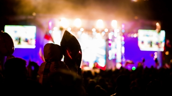 Small Child Watching Concert Sitting On Father's